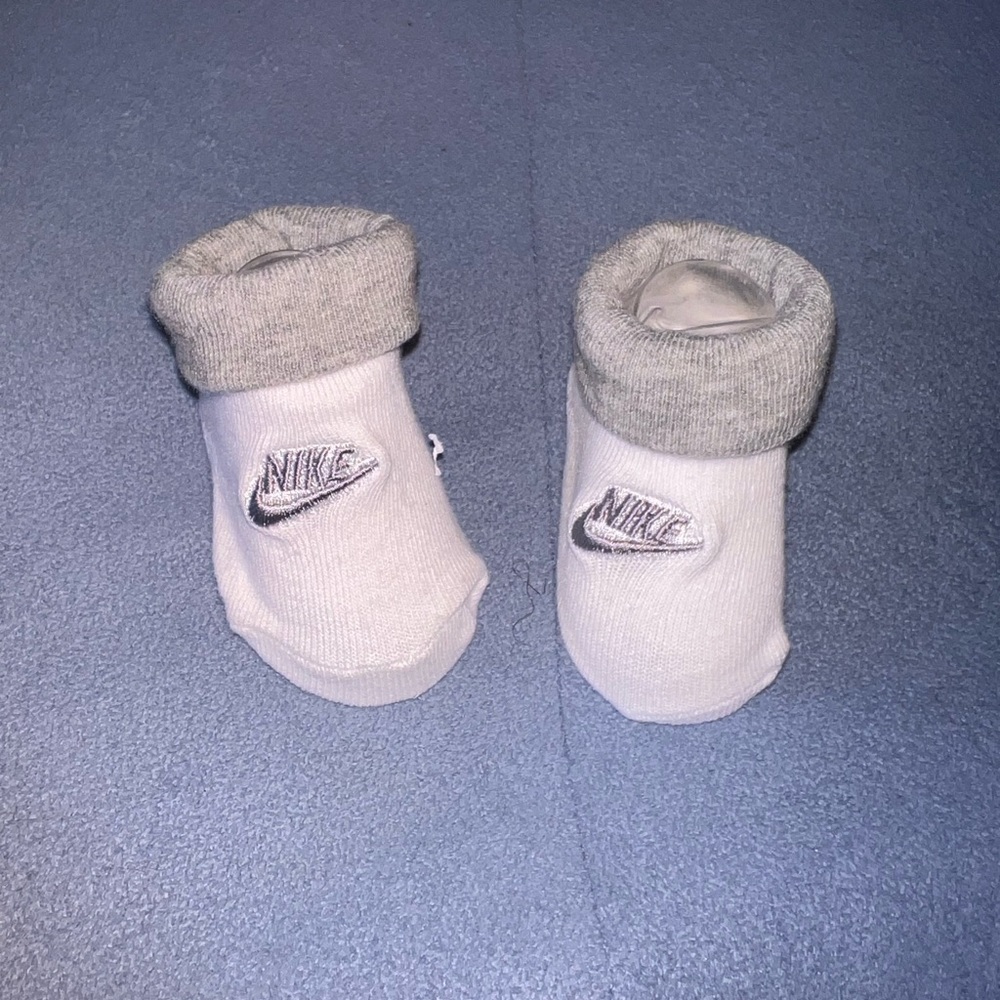 White and gray Nike newborn socks